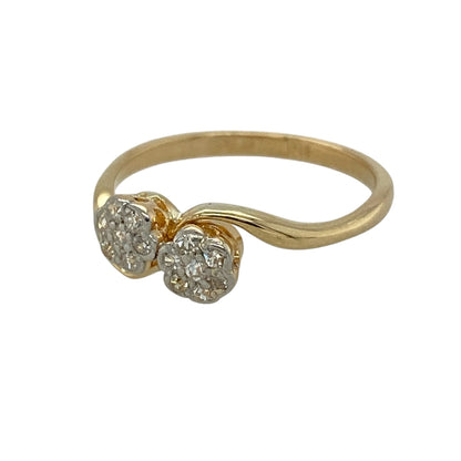 Add distinctive vintage-inspired elegance to your jewellery collection with this pre-owned 18ct yellow gold and platinum diamond double cluster twist ring, featuring an eye-catching design with timeless character.

Design: The ring showcases two sparkling diamond clusters arranged in an elegant twist formation, creating a beautifully balanced design with a distinctive vintage-inspired appearance.