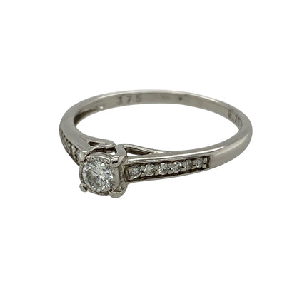 Add timeless elegance and brilliant sparkle to your jewellery collection with this pre-owned 9ct white gold diamond solitaire ring, featuring a beautiful brilliant-cut centre diamond enhanced by diamond-set shoulders.

Design: The ring showcases a brilliant-cut centre diamond weighing approximately 0.25ct, creating an elegant focal point with classic sparkle.