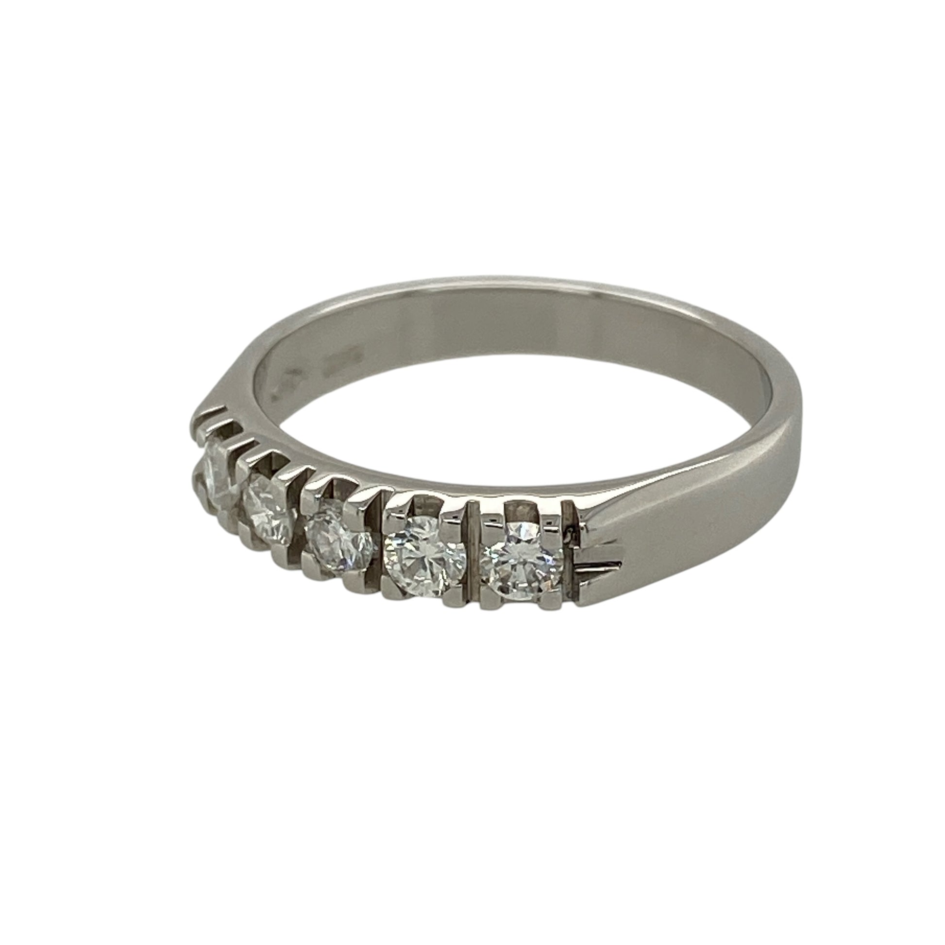 Add timeless sparkle to your fine jewellery collection with this pre-owned 18ct white gold diamond five stone band ring, featuring five diamonds in a classic and elegant setting.

Design: The ring showcases five diamonds arranged across the front of the band, creating a beautifully balanced display of sparkle and sophistication. Measuring approximately 4mm wide across the front, the refined profile makes it suitable for wearing alone, alongside other rings or as an elegant anniversary or milestone piece.