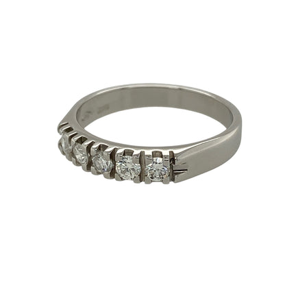 Add timeless sparkle to your fine jewellery collection with this pre-owned 18ct white gold diamond five stone band ring, featuring five diamonds in a classic and elegant setting.

Design: The ring showcases five diamonds arranged across the front of the band, creating a beautifully balanced display of sparkle and sophistication. Measuring approximately 4mm wide across the front, the refined profile makes it suitable for wearing alone, alongside other rings or as an elegant anniversary or milestone piece.