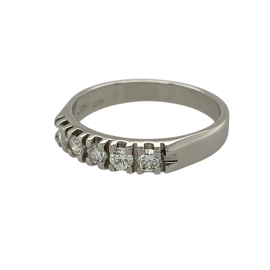 Add timeless sparkle to your fine jewellery collection with this pre-owned 18ct white gold diamond five stone band ring, featuring five diamonds in a classic and elegant setting.

Design: The ring showcases five diamonds arranged across the front of the band, creating a beautifully balanced display of sparkle and sophistication. Measuring approximately 4mm wide across the front, the refined profile makes it suitable for wearing alone, alongside other rings or as an elegant anniversary or milestone piece.