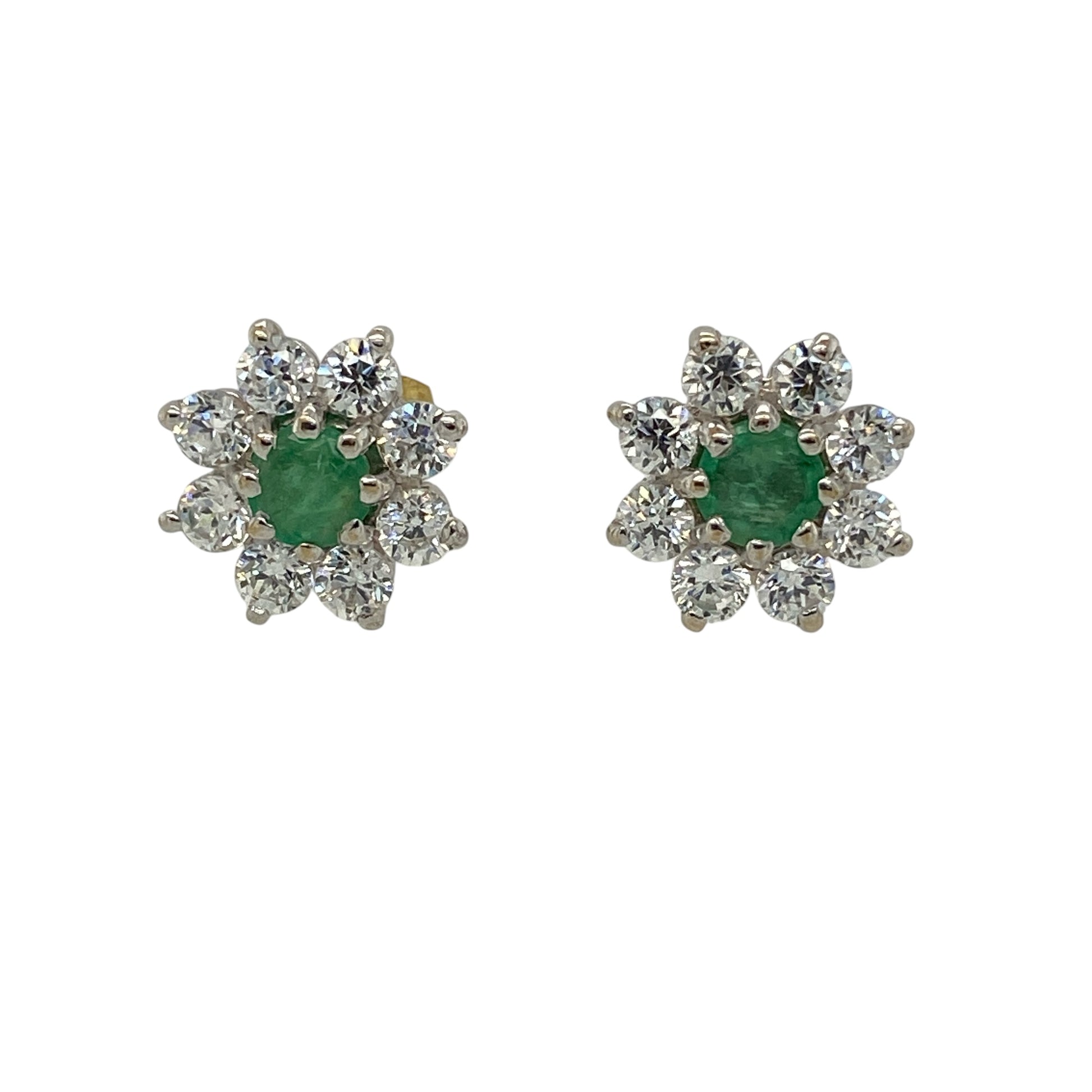 Add a vibrant touch of colour and sparkle to your jewellery collection with these pre-owned 9ct yellow gold green stone and cubic zirconia cluster stud earrings, featuring a classic gemstone-centred design.

Design: Each earring showcases a round green centre stone measuring approximately 4mm in diameter, surrounded by sparkling cubic zirconia stones to create an elegant cluster effect.