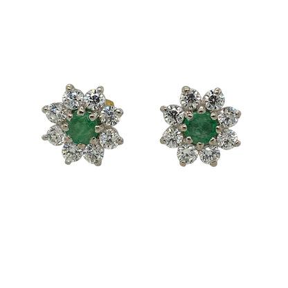 Add a vibrant touch of colour and sparkle to your jewellery collection with these pre-owned 9ct yellow gold green stone and cubic zirconia cluster stud earrings, featuring a classic gemstone-centred design.

Design: Each earring showcases a round green centre stone measuring approximately 4mm in diameter, surrounded by sparkling cubic zirconia stones to create an elegant cluster effect.