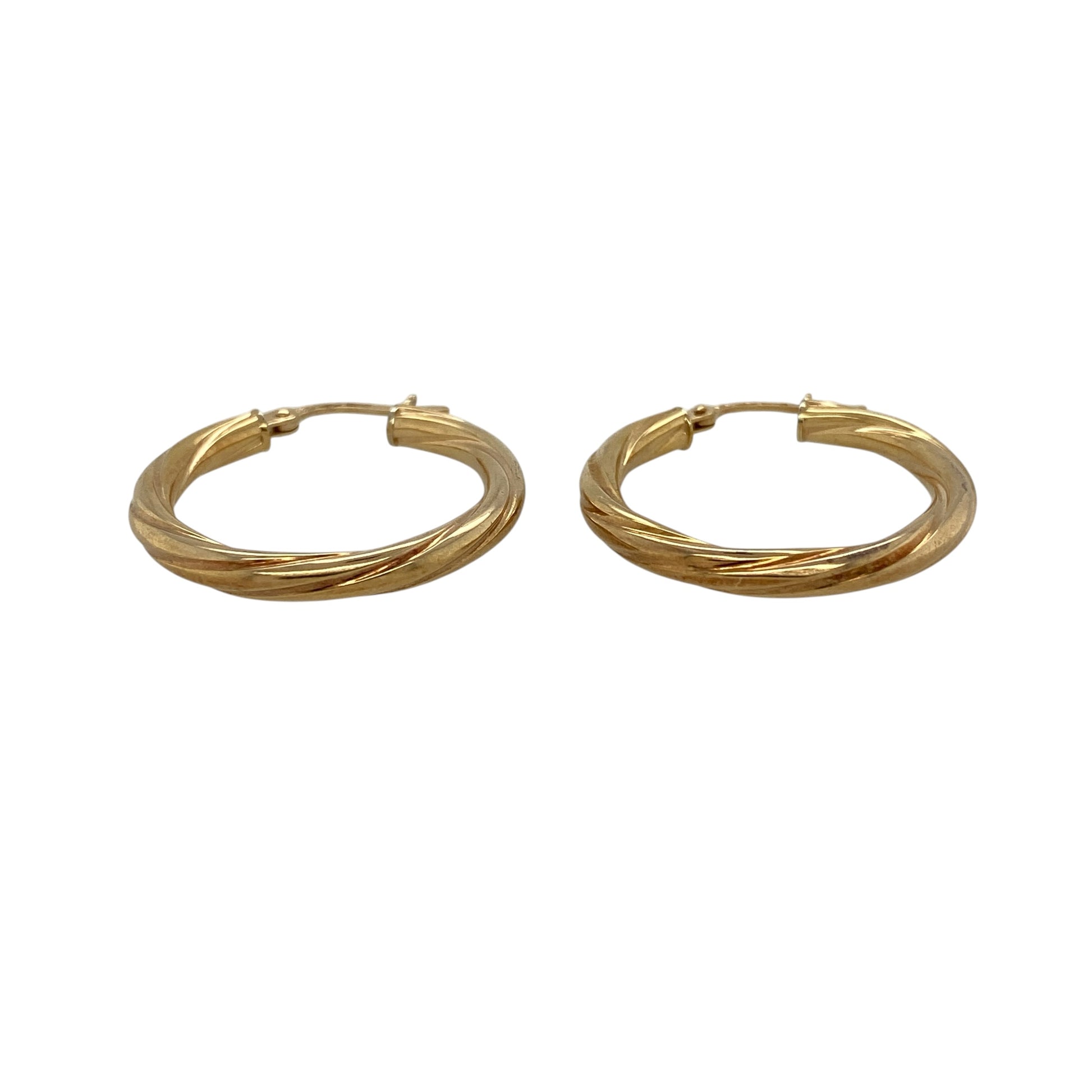 Add timeless style and elegant texture to your jewellery collection with these pre-owned 9ct yellow gold twisted hoop creole earrings, featuring a classic design enhanced by distinctive decorative detailing.

Design: These stylish creole earrings showcase a twisted hoop design that adds depth, texture and visual interest to the traditional circular silhouette.