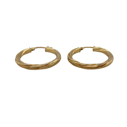 Add timeless style and elegant texture to your jewellery collection with these pre-owned 9ct yellow gold twisted hoop creole earrings, featuring a classic design enhanced by distinctive decorative detailing.

Design: These stylish creole earrings showcase a twisted hoop design that adds depth, texture and visual interest to the traditional circular silhouette.