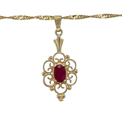 Add vintage-inspired elegance and rich colour to your jewellery collection with this pre-owned 9ct yellow gold ruby filigree-style oval pendant necklace, complete with an 18-inch Singapore chain.

Design: The necklace showcases an elegant oval pendant featuring intricate filigree-style detailing, creating a delicate and decorative appearance with timeless appeal.