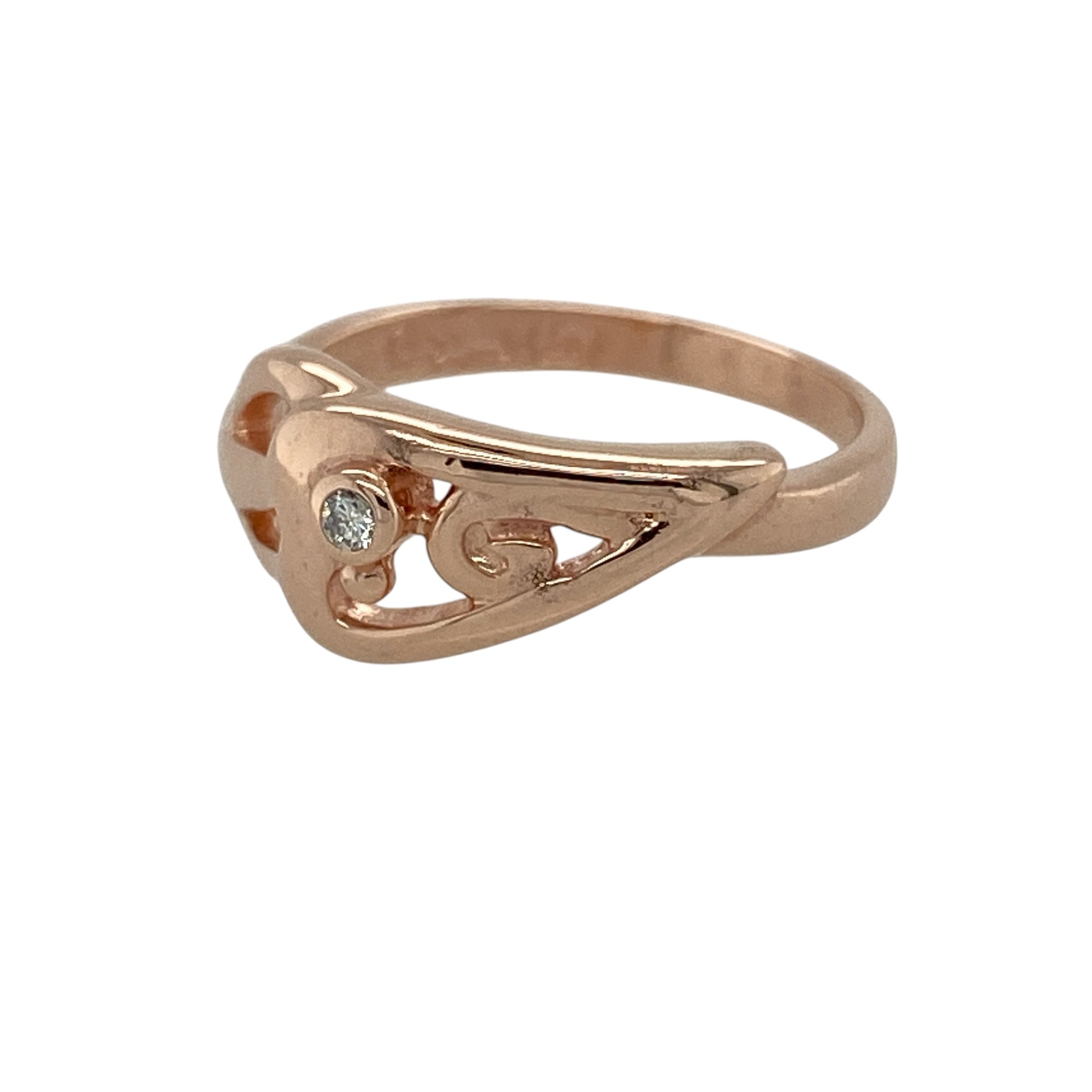 Celebrate romantic symbolism and distinctive Welsh-inspired design with this pre-owned 9ct rose gold diamond Clogau Celtic heart-style ring, featuring elegant interwoven detailing and sparkling diamond accents.

Design: The ring showcases a graceful Celtic heart-style motif formed from flowing, interwoven lines that create a romantic and distinctive appearance. Measuring approximately 8mm high across the front, the design offers an eye-catching presence while retaining an elegant and wearable profile.