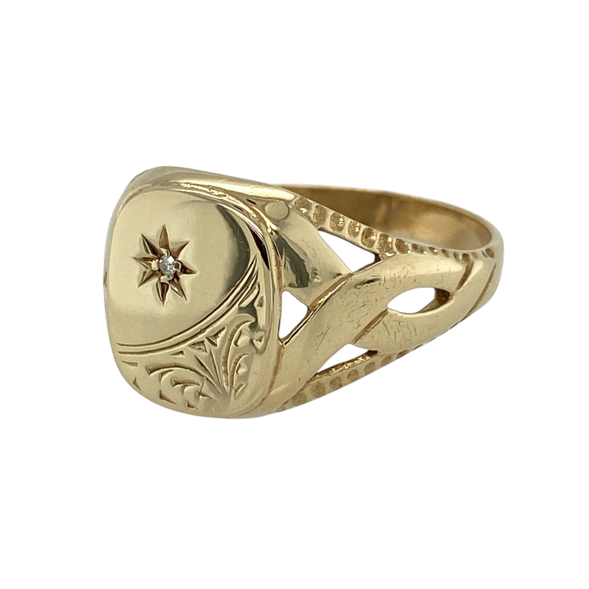 Add distinctive character and sparkling detail to your jewellery collection with this pre-owned 9ct yellow gold diamond patterned signet ring, featuring decorative styling and eye-catching open twist shoulders.

Design: The ring showcases a bold signet-style front enhanced with patterned detailing and diamond accents, creating a distinctive combination of traditional styling and decorative sparkle. Measuring approximately 13mm high across the front, the ring offers an impressive presence on the finger.