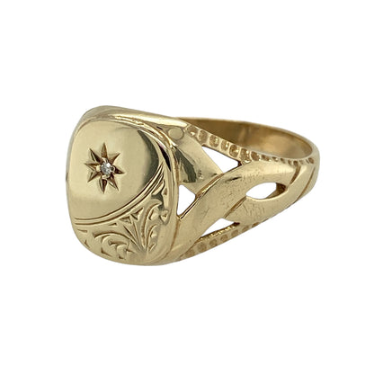 Add distinctive character and sparkling detail to your jewellery collection with this pre-owned 9ct yellow gold diamond patterned signet ring, featuring decorative styling and eye-catching open twist shoulders.

Design: The ring showcases a bold signet-style front enhanced with patterned detailing and diamond accents, creating a distinctive combination of traditional styling and decorative sparkle. Measuring approximately 13mm high across the front, the ring offers an impressive presence on the finger.