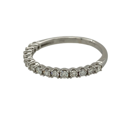 Add refined sparkle and timeless elegance to your fine jewellery collection with this pre-owned 18ct white gold diamond band ring, featuring fifteen brilliant-cut diamonds in a classic and versatile design.

Design: The ring showcases a slim and elegant diamond-set band measuring approximately 2mm wide. Its refined profile and sparkling diamond detailing create a timeless appearance suitable for everyday wear, special occasions or pairing alongside an engagement ring or other fine jewellery.