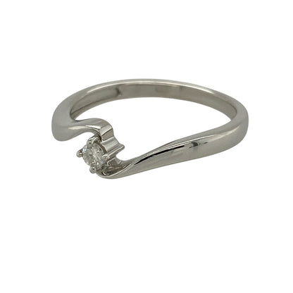 Add contemporary elegance and delicate sparkle to your jewellery collection with this pre-owned 9ct white gold diamond twist solitaire ring, featuring a brilliant-cut diamond in a graceful flowing design.

Design: The ring showcases an elegant twist-style setting that curves around the central diamond, creating a modern and distinctive interpretation of the classic solitaire design. The flowing lines add movement and visual interest while keeping the sparkling centre stone as the main focal point.