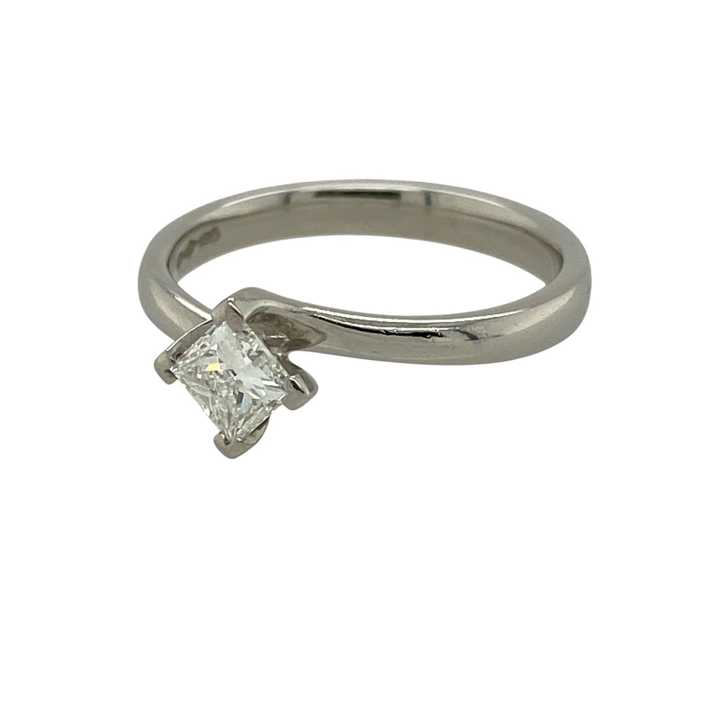 Add contemporary elegance and timeless sparkle to your fine jewellery collection with this pre-owned platinum diamond solitaire twist ring, featuring a princess-cut diamond in a graceful and distinctive setting.

Design: The ring showcases an elegant twist-style design that flows around the central princess-cut diamond, creating a contemporary interpretation of the classic solitaire ring. The graceful curves add movement and visual interest while keeping the diamond as the main focal point.