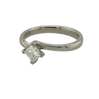 Add contemporary elegance and timeless sparkle to your fine jewellery collection with this pre-owned platinum diamond solitaire twist ring, featuring a princess-cut diamond in a graceful and distinctive setting.

Design: The ring showcases an elegant twist-style design that flows around the central princess-cut diamond, creating a contemporary interpretation of the classic solitaire ring. The graceful curves add movement and visual interest while keeping the diamond as the main focal point.