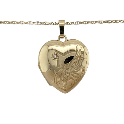 Combine timeless sentiment and elegant sparkle with this pre-owned 9ct yellow gold diamond patterned heart locket necklace, complete with an 18-inch Prince of Wales chain.

Design: The necklace showcases a classic heart-shaped locket enhanced with decorative patterned detailing and sparkling diamond accents. The romantic heart silhouette and intricate finish create a timeless and meaningful piece suitable for everyday wear or special occasions.