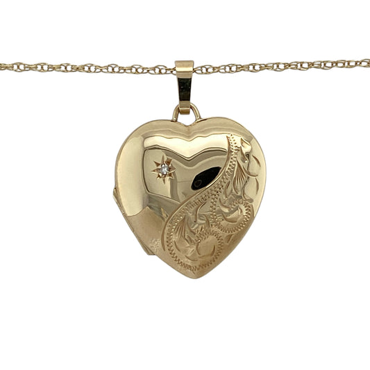 Combine timeless sentiment and elegant sparkle with this pre-owned 9ct yellow gold diamond patterned heart locket necklace, complete with an 18-inch Prince of Wales chain.

Design: The necklace showcases a classic heart-shaped locket enhanced with decorative patterned detailing and sparkling diamond accents. The romantic heart silhouette and intricate finish create a timeless and meaningful piece suitable for everyday wear or special occasions.