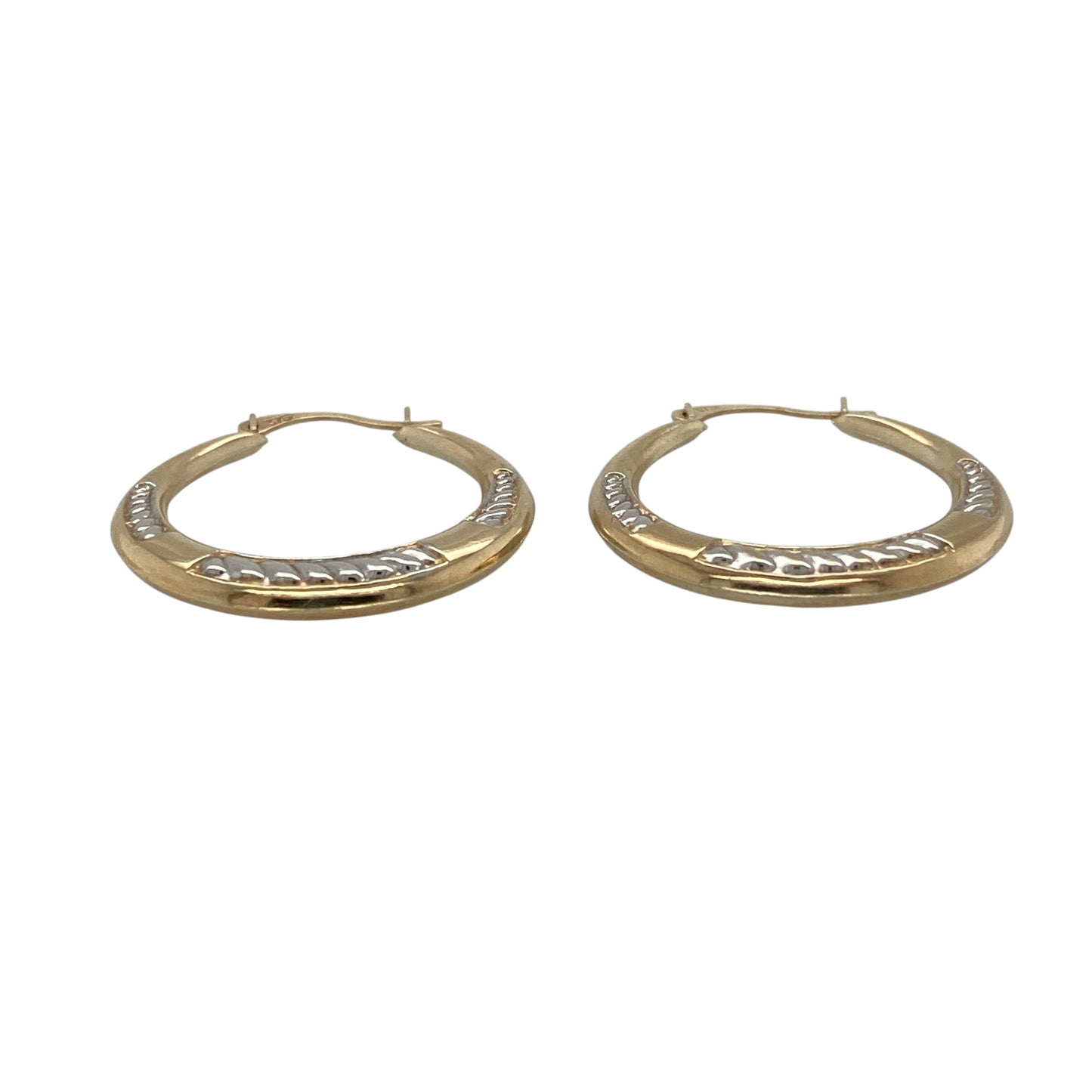 Add versatile two-tone styling and decorative detail to your jewellery collection with these pre-owned 9ct yellow and white gold patterned hoop creole earrings, featuring a classic design with an attractive textured finish.

Design: The earrings showcase a traditional hoop creole profile enhanced with decorative patterning, creating additional texture and visual interest.