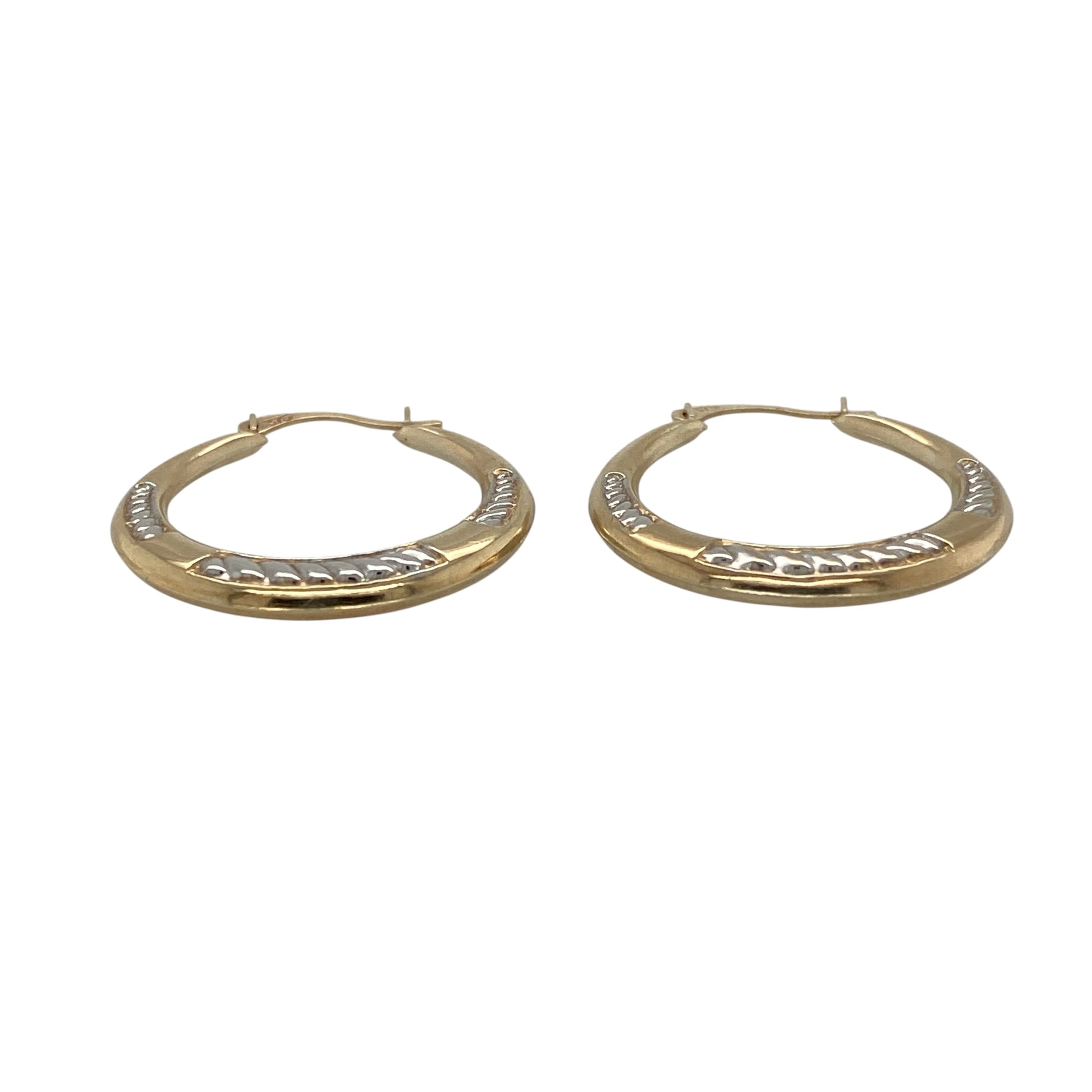 Add versatile two-tone styling and decorative detail to your jewellery collection with these pre-owned 9ct yellow and white gold patterned hoop creole earrings, featuring a classic design with an attractive textured finish.

Design: The earrings showcase a traditional hoop creole profile enhanced with decorative patterning, creating additional texture and visual interest.
