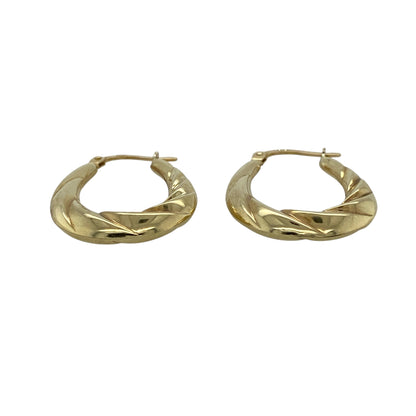 Add timeless elegance and attractive texture to your jewellery collection with these pre-owned 9ct yellow gold twisted oval creole earrings, featuring a classic design with a distinctive decorative finish.

Design: The earrings showcase an elegant oval creole profile enhanced with twisted detailing, creating texture, dimension and visual interest.