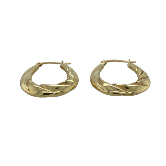 Add timeless elegance and attractive texture to your jewellery collection with these pre-owned 9ct yellow gold twisted oval creole earrings, featuring a classic design with a distinctive decorative finish.

Design: The earrings showcase an elegant oval creole profile enhanced with twisted detailing, creating texture, dimension and visual interest.