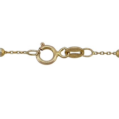 Add contemporary sparkle and versatile two-tone styling to your jewellery collection with this pre-owned 9ct yellow and white gold 17-inch sparkle ball chain necklace, featuring decorative oval beads with an eye-catching textured finish.

Design: The necklace showcases a stylish ball chain design featuring oval-shaped decorative beads that create texture, dimension and visual interest along the neckline.