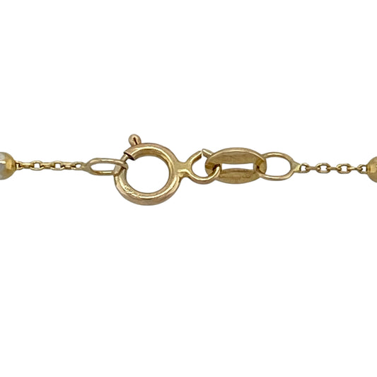 Add contemporary sparkle and versatile two-tone styling to your jewellery collection with this pre-owned 9ct yellow and white gold 17-inch sparkle ball chain necklace, featuring decorative oval beads with an eye-catching textured finish.

Design: The necklace showcases a stylish ball chain design featuring oval-shaped decorative beads that create texture, dimension and visual interest along the neckline.