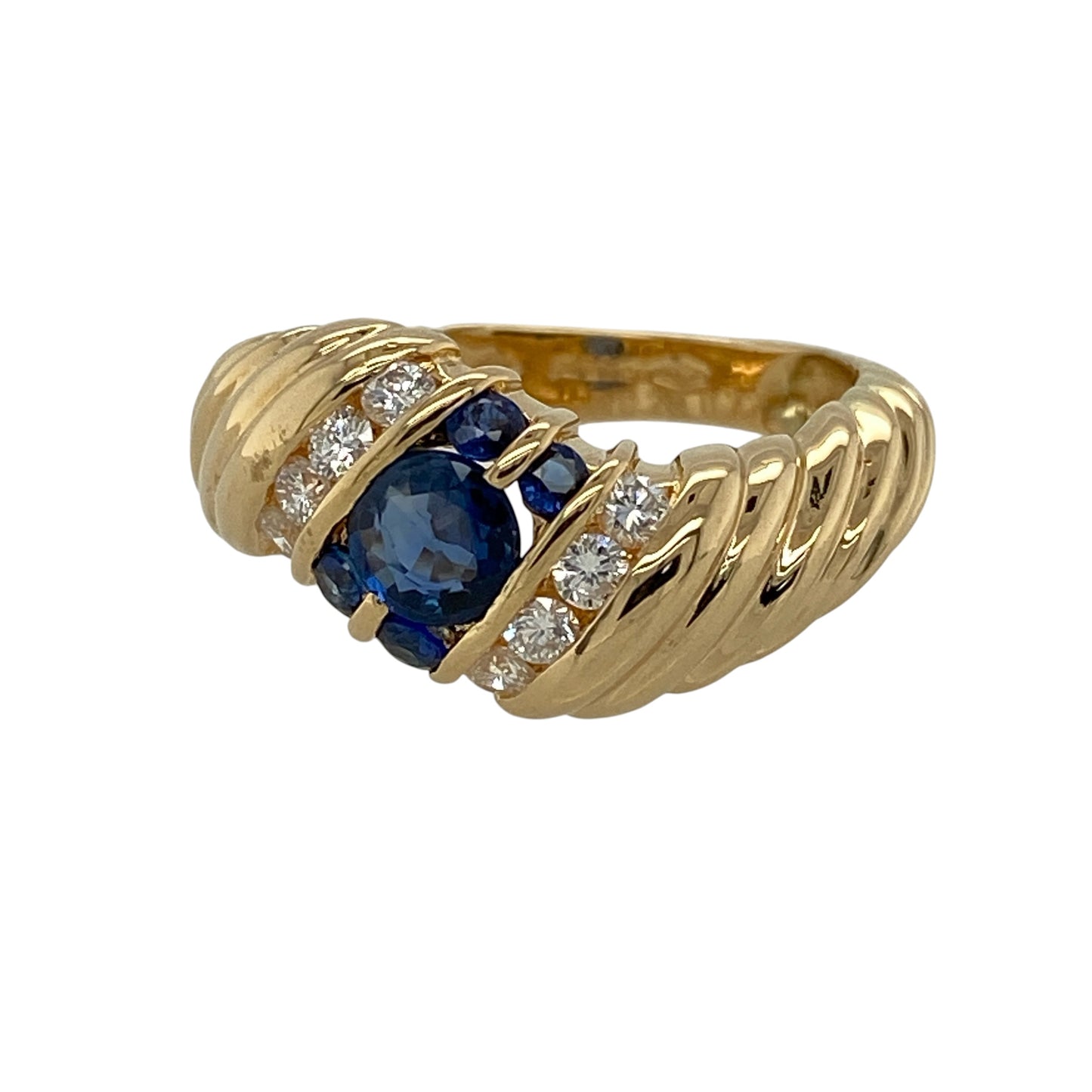 Add rich colour, elegant sparkle and substantial fine jewellery styling to your collection with this pre-owned 18ct yellow gold diamond and sapphire twist band ring, featuring a striking central sapphire complemented by sparkling diamond detailing.

Design: The ring showcases an elegant twist-style band design centred around a beautiful sapphire.