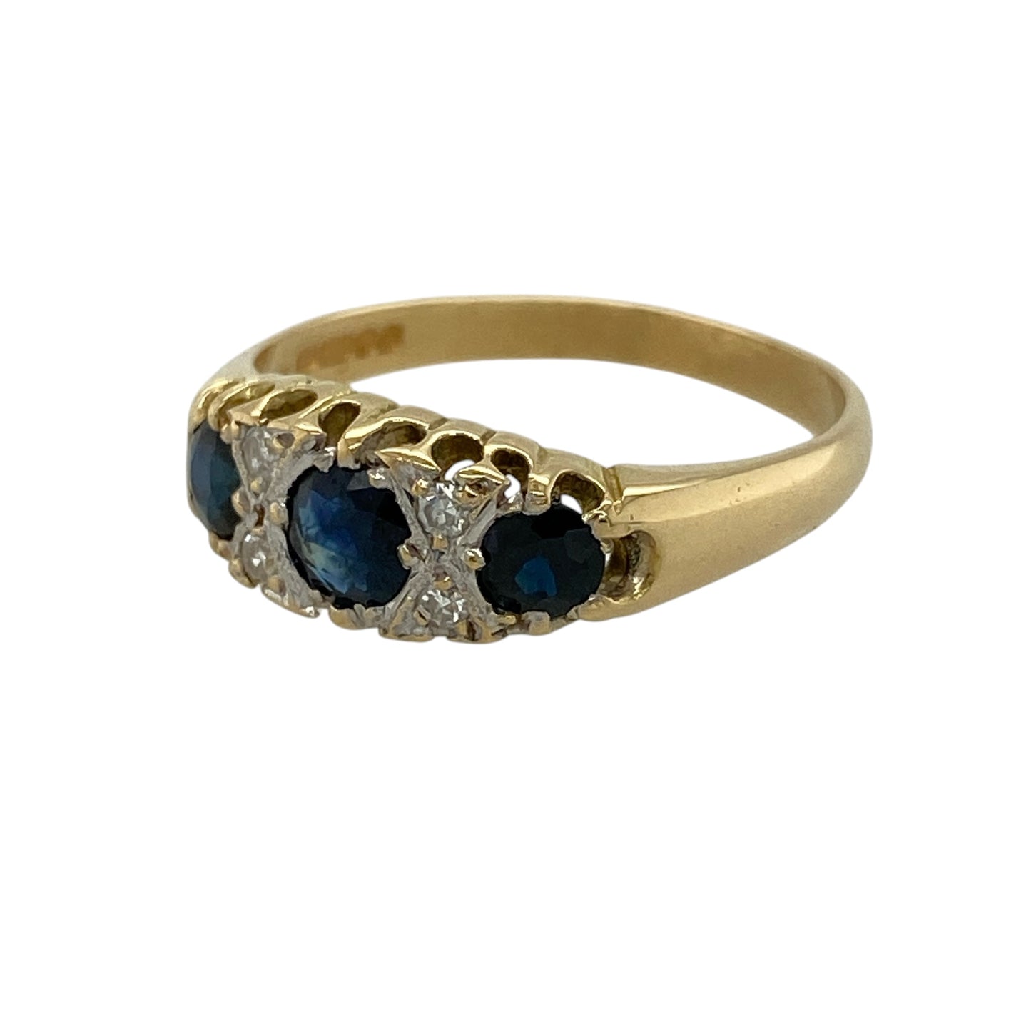Add rich colour and timeless elegance to your fine jewellery collection with this pre-owned 18ct yellow gold diamond and sapphire trilogy band ring, featuring three beautiful sapphires complemented by sparkling diamond detailing.

Design: The ring showcases an elegant trilogy-style arrangement featuring three round sapphires set across the front of the band.