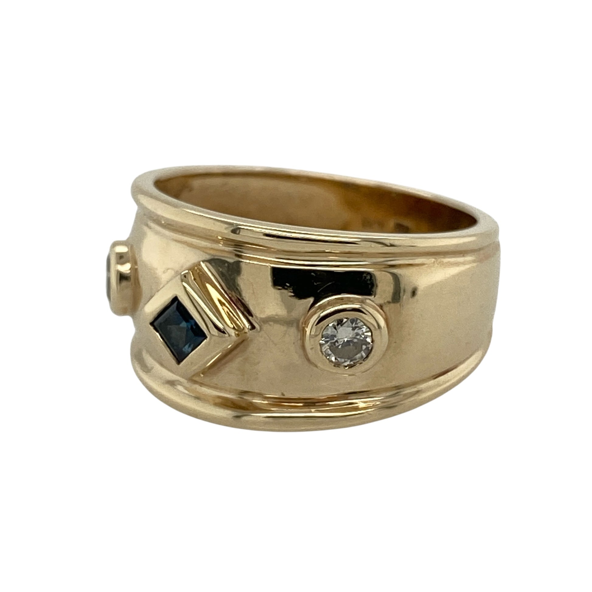 Add rich colour, sparkling brilliance and distinctive wide-band styling to your jewellery collection with this pre-owned 9ct yellow gold diamond and sapphire wide band ring, featuring a square sapphire complemented by two brilliant cut diamonds.

Design: The ring showcases an eye-catching wide band design with a decorative front measuring approximately 11mm high.