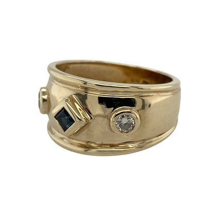 Add rich colour, sparkling brilliance and distinctive wide-band styling to your jewellery collection with this pre-owned 9ct yellow gold diamond and sapphire wide band ring, featuring a square sapphire complemented by two brilliant cut diamonds.

Design: The ring showcases an eye-catching wide band design with a decorative front measuring approximately 11mm high.