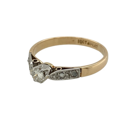 Add timeless elegance and classic diamond styling to your fine jewellery collection with this pre-owned 18ct yellow gold and platinum diamond solitaire ring, featuring a brilliant cut centre diamond complemented by delicate diamond-set shoulders.

Design: The ring showcases a classic solitaire-style design centred around a sparkling brilliant cut diamond.