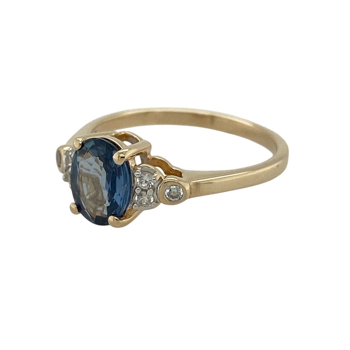 Add rich colour and elegant sparkle to your jewellery collection with this pre-owned 9ct yellow gold sapphire-coloured stone and cubic zirconia ring, featuring a striking oval centre stone complemented by sparkling shoulder detailing.

Design: The ring showcases a classic gemstone design centred around an eye-catching oval sapphire-coloured stone.