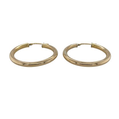 Add timeless elegance and versatile styling to your jewellery collection with these pre-owned 9ct yellow gold plain hoop creole earrings, featuring a classic design with enduring appeal.

Design: The earrings showcase a traditional hoop creole profile with a smooth, plain finish, creating a clean and elegant appearance. Their timeless design makes them suitable for everyday wear, special occasions or pairing with a wide variety of other jewellery styles.