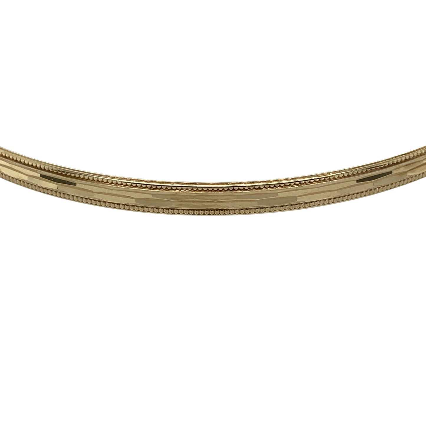 Add timeless elegance and decorative texture to your jewellery collection with this pre-owned 9ct yellow solid gold patterned bangle, featuring attractive detailing with refined milgrain edges.

Design: The bangle showcases a classic slim profile enhanced with decorative patterning and elegant milgrain edge detailing, creating texture and visual interest while retaining a timeless and versatile appearance.