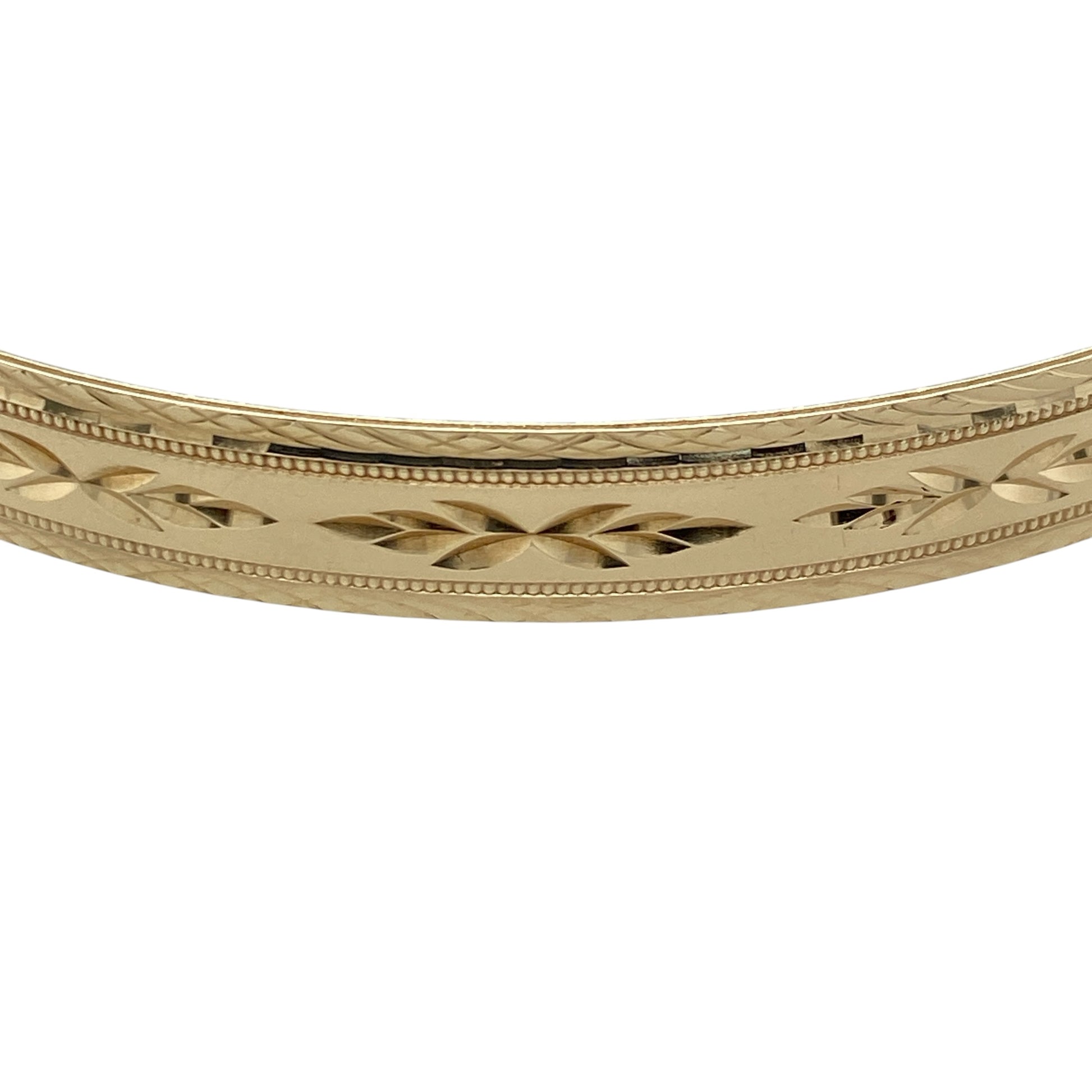 Add timeless elegance and distinctive decorative detail to your jewellery collection with this pre-owned 9ct yellow solid gold patterned bangle, featuring an attractive textured design with a substantial profile.

Design: The bangle showcases a classic profile enhanced with decorative patterning, creating texture, depth and visual interest while retaining a timeless and versatile appearance suitable for everyday wear or special occasions.