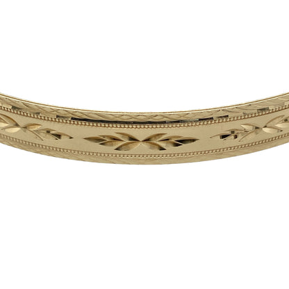 Add timeless elegance and distinctive decorative detail to your jewellery collection with this pre-owned 9ct yellow solid gold patterned bangle, featuring an attractive textured design with a substantial profile.

Design: The bangle showcases a classic profile enhanced with decorative patterning, creating texture, depth and visual interest while retaining a timeless and versatile appearance suitable for everyday wear or special occasions.