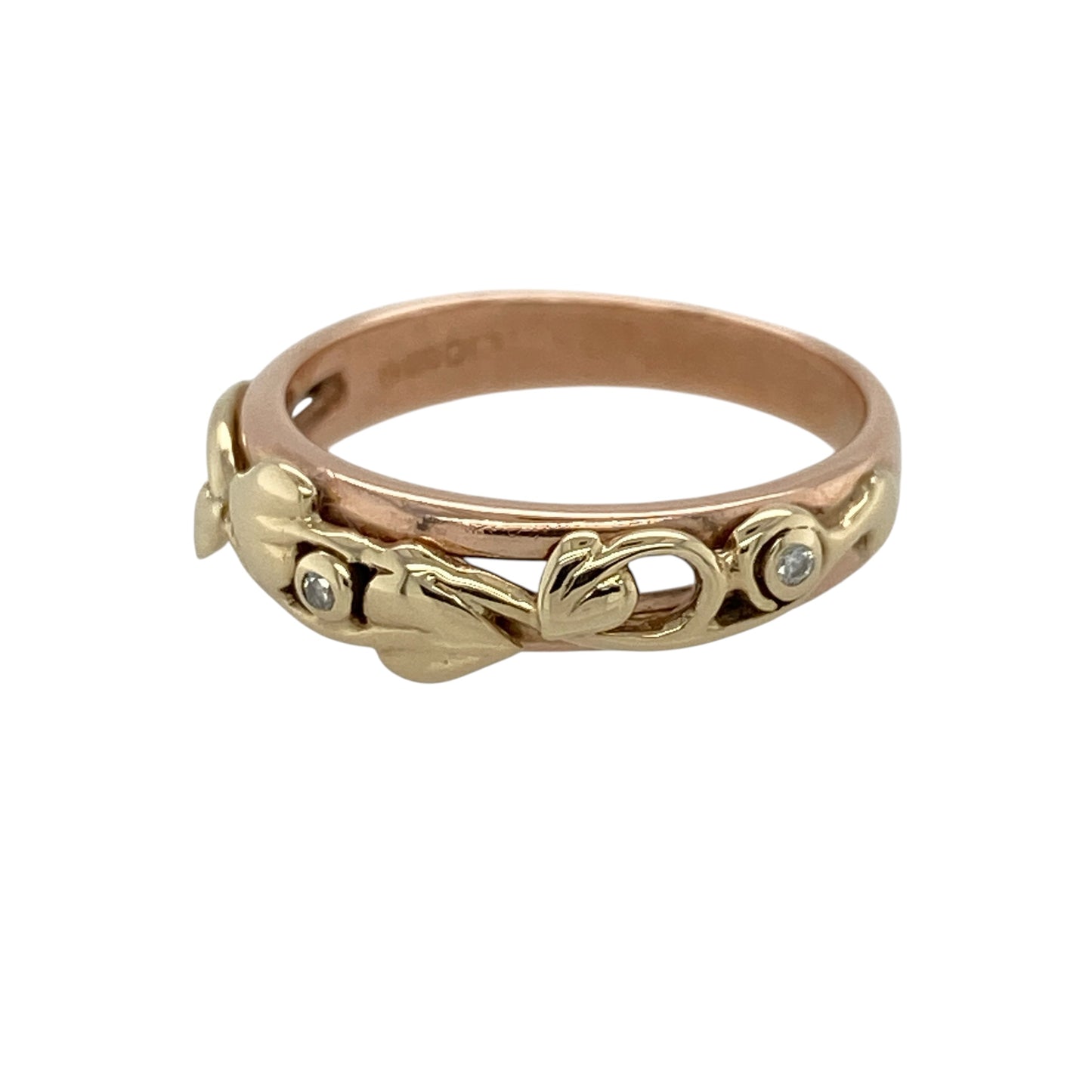 Bring symbolic beauty and delicate sparkle to your collection with this pre-owned 9ct yellow and rose gold Clogau Tree of Life band ring, featuring subtle diamond accents and a meaningful design—perfect for celebrating connection, growth, and heritage.

Design: The front of the band measures 5mm wide and showcases Clogau’s signature Tree of Life motif, with flowing vines and leaf details in a blend of yellow and rose gold.