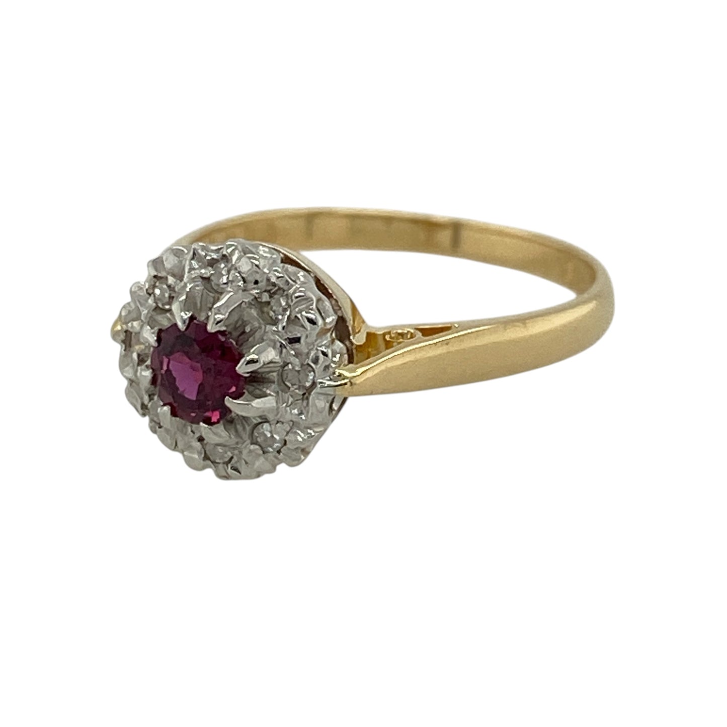 Add rich colour and timeless elegance to your jewellery collection with this pre-owned 18ct yellow gold diamond and ruby cluster ring, featuring a classic gemstone design with sparkling diamond detailing.

Design: The ring showcases a traditional cluster-style design centred around a vibrant ruby and complemented by surrounding diamonds, creating an attractive combination of rich colour and brilliance suitable for everyday wear or special occasions.