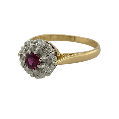 Add rich colour and timeless elegance to your jewellery collection with this pre-owned 18ct yellow gold diamond and ruby cluster ring, featuring a classic gemstone design with sparkling diamond detailing.

Design: The ring showcases a traditional cluster-style design centred around a vibrant ruby and complemented by surrounding diamonds, creating an attractive combination of rich colour and brilliance suitable for everyday wear or special occasions.