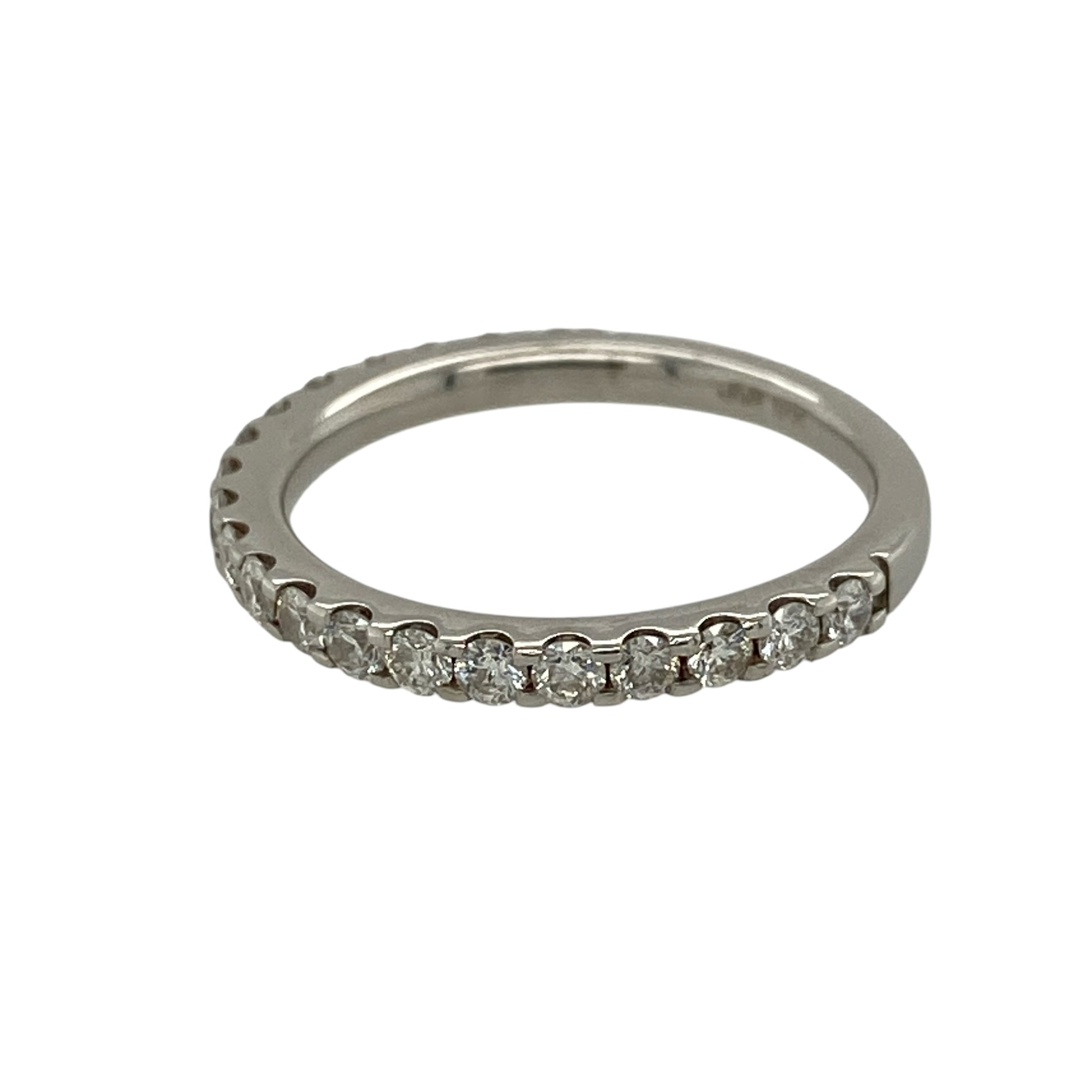 Add timeless elegance and refined sparkle to your jewellery collection with this pre-owned 18ct white gold and diamond half eternity band ring, featuring a classic design with substantial diamond content.

Design: The ring showcases a traditional half eternity design with diamonds set across the front section of the band, creating an elegant line of sparkle and a timeless appearance suitable for everyday wear or special occasions.