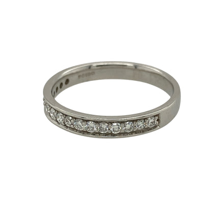 Add timeless elegance and refined sparkle to your jewellery collection with this pre-owned 18ct white gold and diamond half eternity style band ring, featuring a classic design set with seventeen brilliant cut diamonds.

Design: The ring showcases a traditional half eternity style design with a row of brilliant cut diamonds set across the front section of the band, creating an elegant line of sparkle and a timeless appearance suitable for everyday wear or special occasions.
