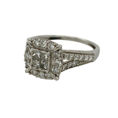 Add refined sparkle and intricate detailing to your jewellery collection with this pre-owned 9ct white gold and diamond cluster ring, featuring a striking combination of princess and brilliant cut diamonds with elegant milgrain edging.

Design: The ring showcases an eye-catching cluster design centred around four princess cut diamonds, surrounded by brilliant cut diamonds that continue onto the split shoulders.