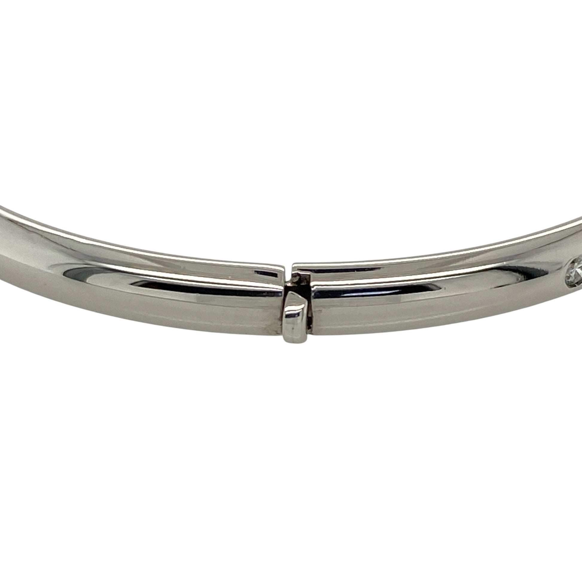 Add timeless elegance and refined sparkle to your jewellery collection with this pre-owned 9ct white gold and diamond hinged bangle, featuring a classic design set with five diamonds.

Design: The bangle showcases a classic hinged profile enhanced with five diamond accents, creating an elegant and versatile design with subtle sparkle suitable for everyday wear or special occasions.