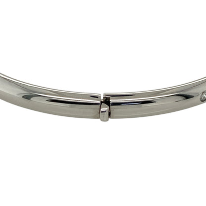 Add timeless elegance and refined sparkle to your jewellery collection with this pre-owned 9ct white gold and diamond hinged bangle, featuring a classic design set with five diamonds.

Design: The bangle showcases a classic hinged profile enhanced with five diamond accents, creating an elegant and versatile design with subtle sparkle suitable for everyday wear or special occasions.