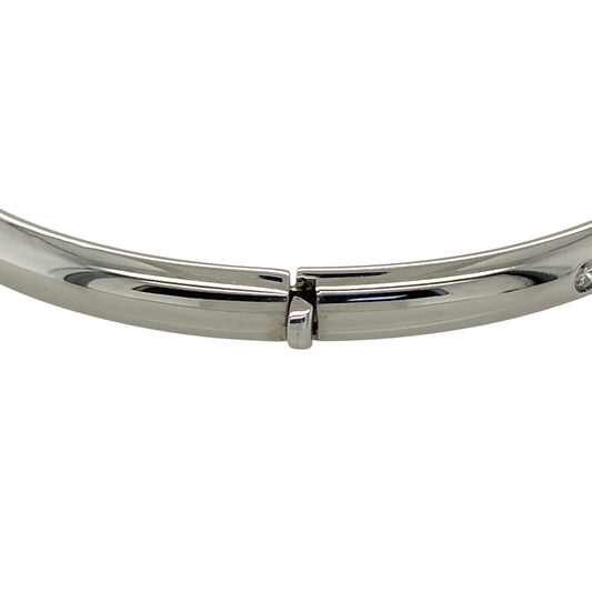 Add timeless elegance and refined sparkle to your jewellery collection with this pre-owned 9ct white gold and diamond hinged bangle, featuring a classic design set with five diamonds.

Design: The bangle showcases a classic hinged profile enhanced with five diamond accents, creating an elegant and versatile design with subtle sparkle suitable for everyday wear or special occasions.