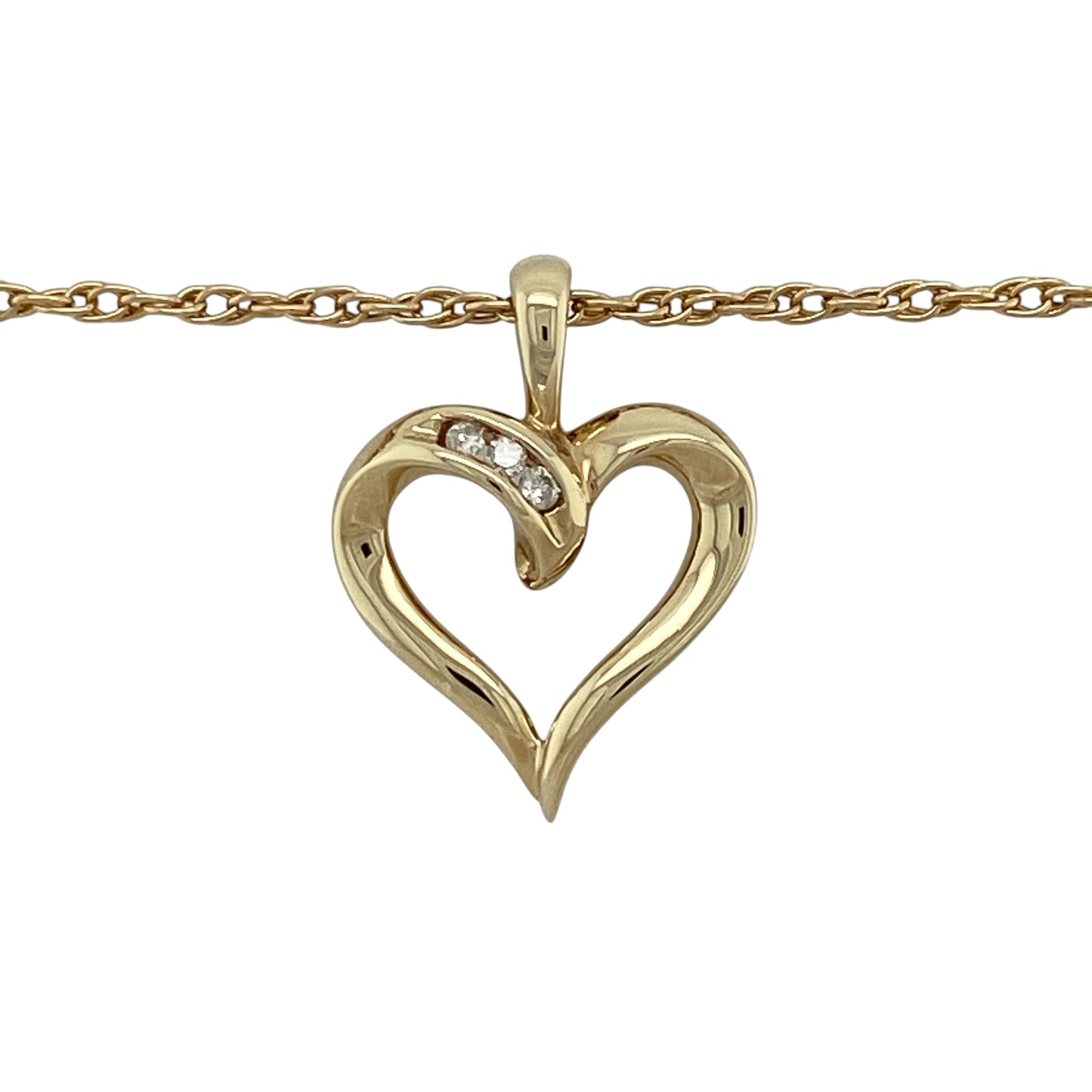 Add romantic symbolism and timeless sparkle to your jewellery collection with this pre-owned 9ct yellow gold and diamond open heart pendant necklace, featuring an elegant design suspended from a classic Prince of Wales chain.

Design: The necklace showcases a graceful open heart pendant enhanced with diamond detailing and suspended from an 18-inch Prince of Wales chain, creating a romantic and versatile design suitable for everyday wear or special occasions.