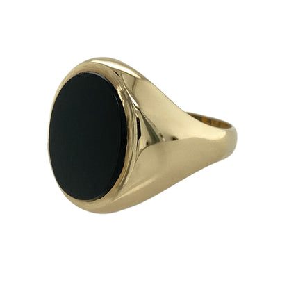 Add timeless sophistication and bold gemstone styling to your jewellery collection with this pre-owned 9ct yellow gold and onyx oval signet ring, featuring a substantial black onyx stone in a classic design.

Design: The ring showcases a traditional signet-style profile centred around a large oval onyx stone, creating a bold and distinctive appearance suitable for everyday wear or special occasions.
