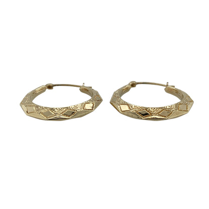 Add timeless styling and decorative detail to your jewellery collection with these pre-owned 9ct yellow gold patterned round creole earrings, featuring a classic hoop design with an attractive textured finish.

Design: The earrings showcase a traditional round creole profile enhanced with decorative patterning, creating additional texture and visual interest while retaining the timeless appeal of classic gold hoop earrings.