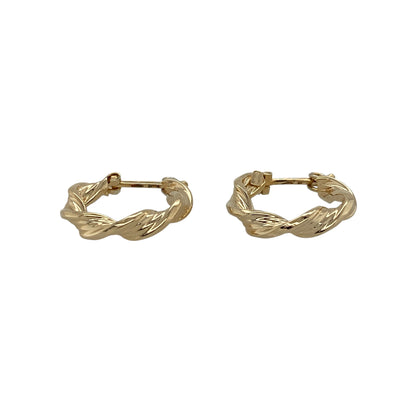 Add timeless styling and decorative texture to your jewellery collection with these pre-owned 9ct yellow gold twisted hoop creole earrings, featuring a classic design with an attractive spiral effect.

Design: The earrings showcase a traditional round hoop creole profile enhanced with twisted detailing, creating additional texture and visual interest while retaining the timeless appeal of classic gold hoop earrings.