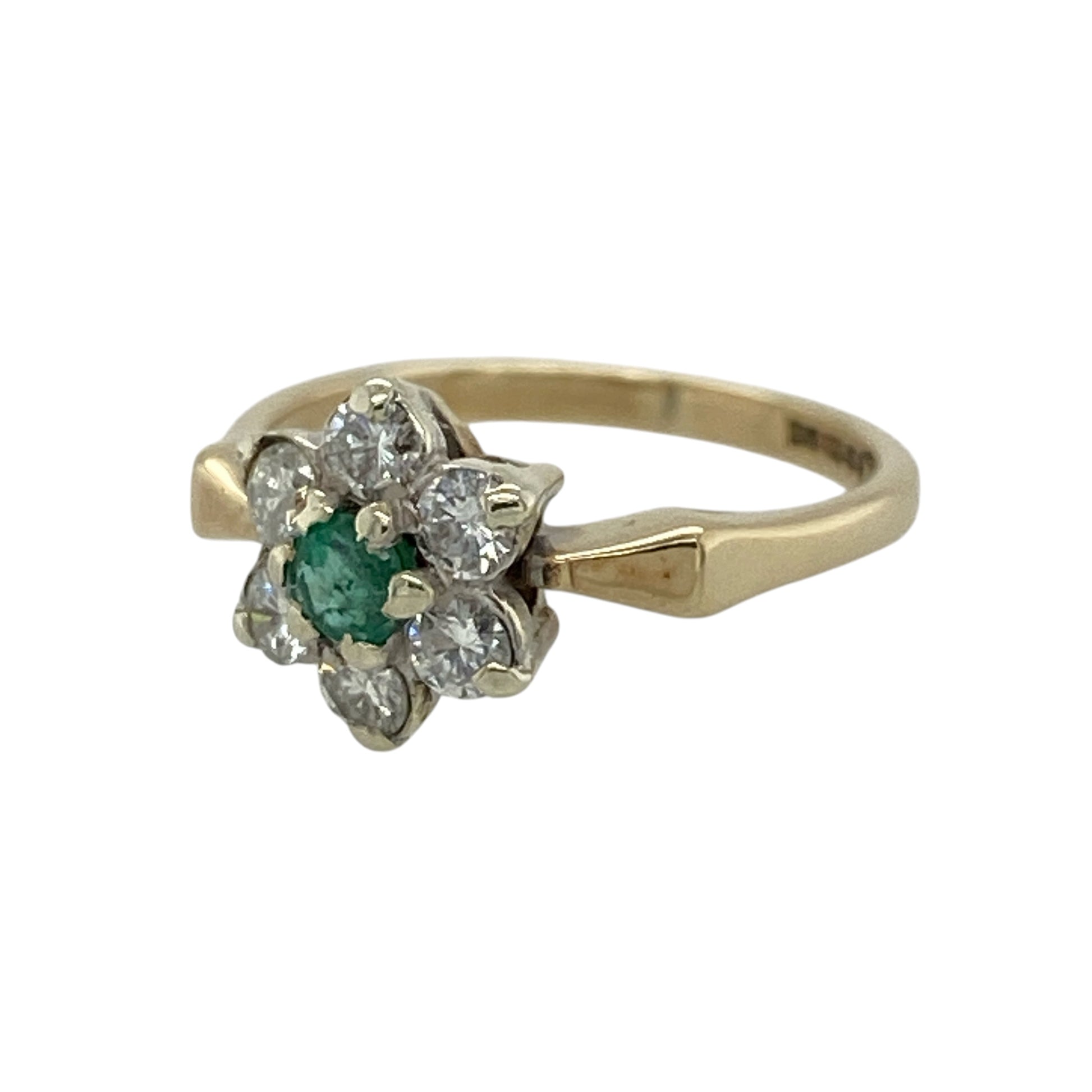 Add rich gemstone colour and elegant sparkle to your jewellery collection with this pre-owned 9ct yellow gold diamond and emerald flower cluster ring, featuring a classic floral-inspired design with timeless appeal.

Design: The ring showcases an elegant flower cluster design centred around a round emerald, surrounded by sparkling diamonds that create a distinctive floral appearance suitable for everyday wear or special occasions.