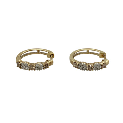 Add distinctive diamond colour and elegant sparkle to your jewellery collection with these pre-owned 9ct yellow gold chocolate and white diamond hoop earrings, featuring a striking combination of contrasting diamond tones.

Design: The earrings showcase a classic hoop profile enhanced with chocolate and white diamonds, creating an attractive contrast of warm colour and bright sparkle with a distinctive and elegant appearance.